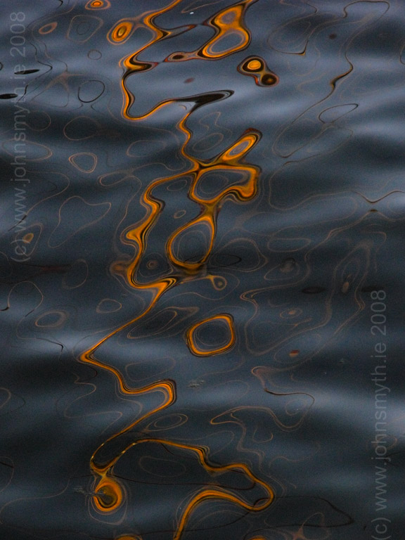 Reflection of a boat's mast in the Claddagh